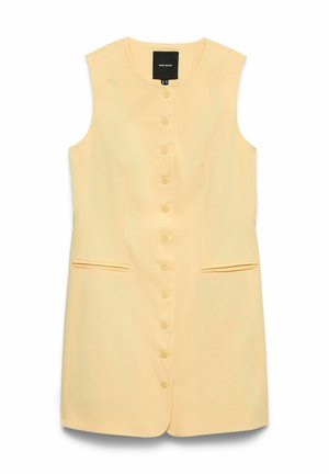 Robe sans manches jaune pâle à boutons, avec col rond, deux poches fendues à l'avant, et une étiquette noire à l'intérieur du col.