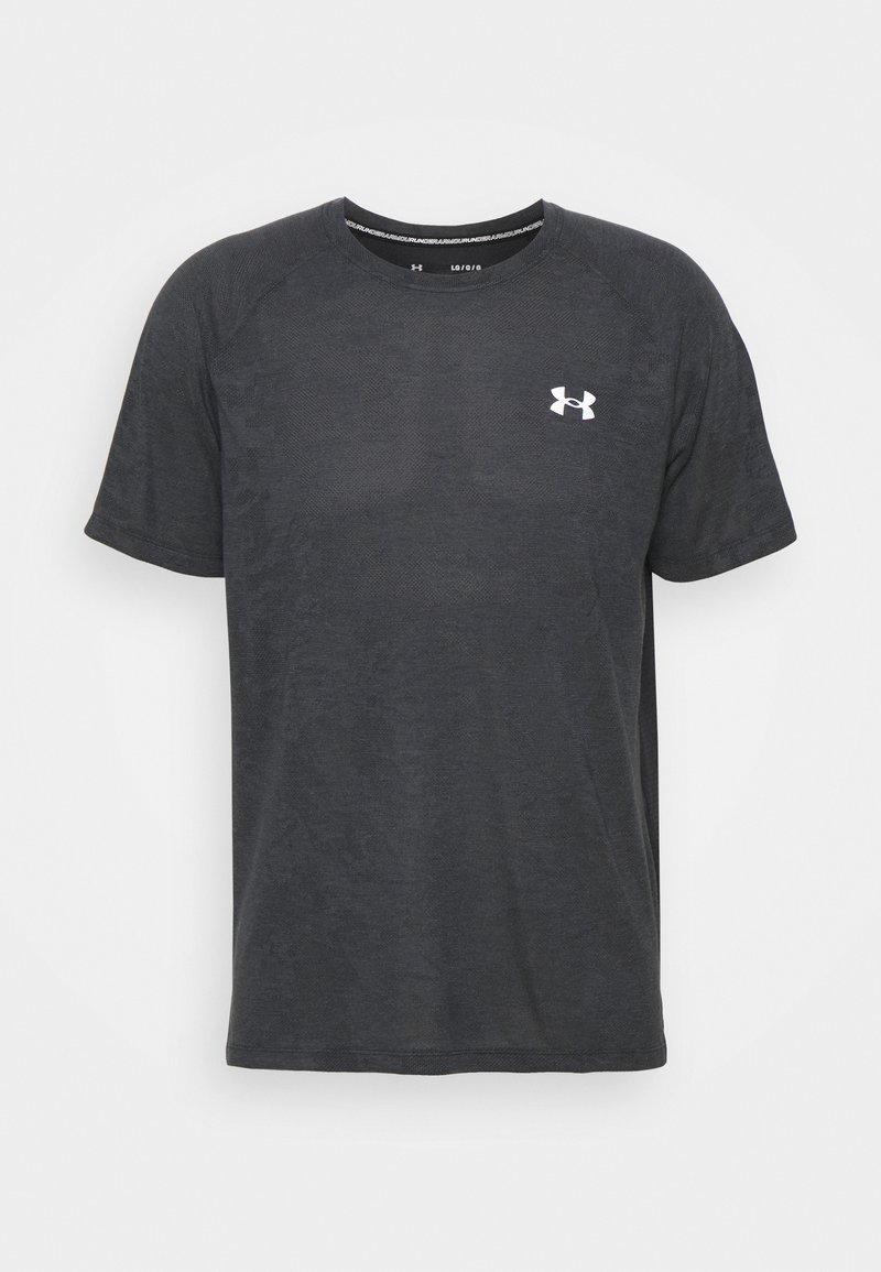T-shirt de sport noir en matériau doux et léger. Il présente des manches courtes, un col rond et un petit logo blanc sur la poitrine.