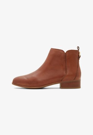 Brauner Leder-Stiefelette mit niedrigem Blockabsatz, seitlichem Elastikeinsatz und hinterem Zuglaschen mit Reißverschluss-Detail.
