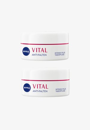 NIVEA VITAL Anti-Falten, two round white cream jars with red accents, labeled "INTENSIV PLUS TAGESPFLEGE" in blue and red text.