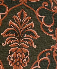Textured green background features an intricate orange floral and pineapple pattern, highlighting detailed curves and symmetrical designs.