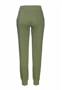 Groene joggingsbroek van zacht stof, met een elastische tailleband en ribgebreide boorden, met een gladde textuur en zonder zichtbare zakken.