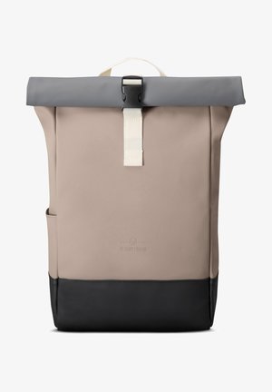 Roll-top backpack in beige with a gray top and black base. Features a front pocket, adjustable strap, and minimal branding.