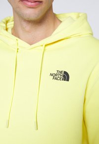 The North Face Jersey con capucha - yellow