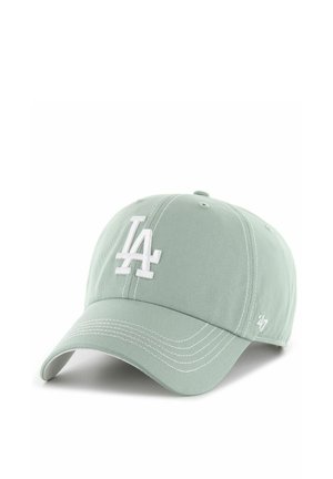 Light green baseball cap with white stitched "LA" logo on front and white "47" logo on side, curved brim, and ventilation eyelets.