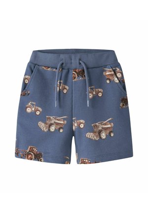 Blå elastiske taljeshorts med snøre, sidelommer og et mønster af brune og beige traktorer og landbrugsmaskiner.