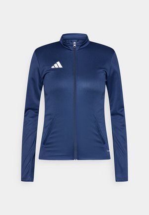 Marineblaue Reißverschlussjacke aus glattem, leichtem Stoff. Verfügt über einen hohen Kragen, lange Ärmel, zwei Seitentaschen und ein weißes Logo.