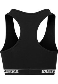 Crni sportski grudnjak s dizajnom racerback, izrađen od rastezljivog materijala. Sadrži bijelu traku s logom "URBAN CLASSICS" duž dna.