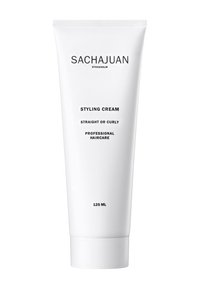 Crema per lo styling SACHAJUAN in un tubo bianco e pressabile, etichettato per capelli lisci o ricci, con testo nero e un volume di 125 ml.