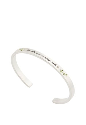 Silver open cuff bracelet with engraved text "she walks where stars forget to fall" and small green leaf and star decorations.