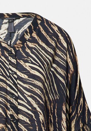 Black and cream animal print blouse with a V-neck, button closure, and a loose fit, featuring a smooth texture and flowing fabric.