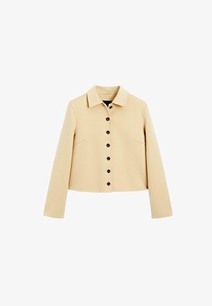 Veste en laine beige avec un col, neuf boutons noirs sur le devant, des manches longues et des poches latérales.