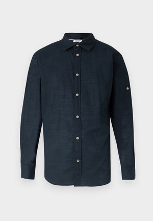 Dunkelblaues, langärmliges Hemd mit Knöpfen, Kragen und jeweils einem Knopf an den Manschetten, vor hellem Hintergrund dargestellt.