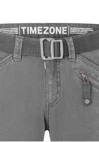 Gray pants with a woven belt, featuring a texture pattern, side zipper pocket, and logo on the waistband. Durable fabric design.