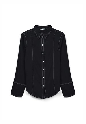 Black long-sleeve shirt featuring white contrast stitching, a classic collar, buttoned front, and rounded hemline.
