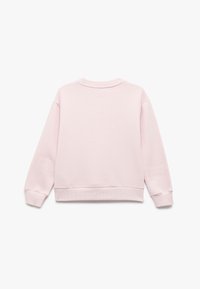 Jasnoróżowa bluza z długimi rękawami, okrągłym dekoltem i ściągaczami. Miły w dotyku materiał o czystym, minimalistycznym designie.