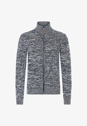 Full-zip knitted sweater with high collar, long sleeves, and a navy and white marled pattern.