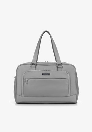 Sac en textile gris avec deux poignées, surface lisse, poche zippée à l'avant et forme rectangulaire. Présente un logo discret à l'avant.