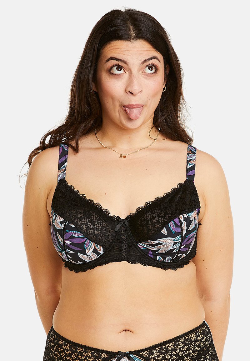 Soutien-gorge en dentelle noire avec un motif de feuilles colorées, doté de bretelles ajustables, de bords festonnés et d'un accent central en forme de nœud.