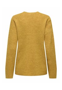 Dzeltena sinepju krāsas tamborēta džemperis ar rievotu tekstūru. Aprīkots ar garām piedurknēm un plašu kakla izgriezumu, radot vienkāršu, atslābinātu siluetu.