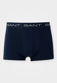 Sötétkék boxer alsónadrág, pamutból készült, logós elasztikus derékpánttal, amelyen folyamatosan ismétlődik a "GANT" felirat, és puha, sima tapintású.