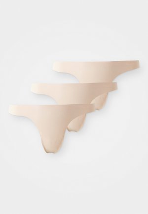 Three pairs of nude thongs featuring a smooth texture and minimal coverage, with a simple design and elastic waistbands.