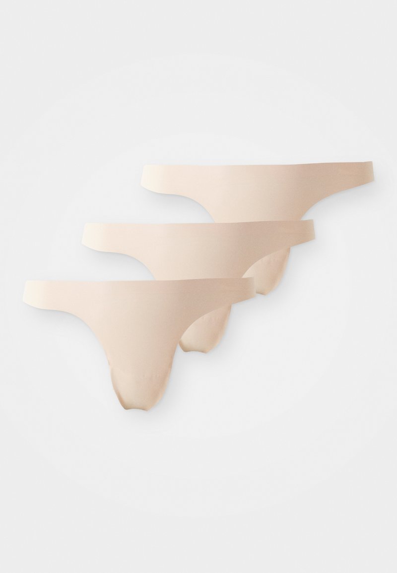 Tri pari golih tangic z gladko teksturo in minimalno pokritostjo, s preprostim dizajnom in elastičnimi pasovi.