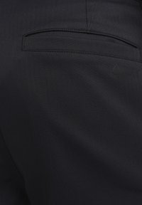 TOUR REPEL - Pantalones - black black