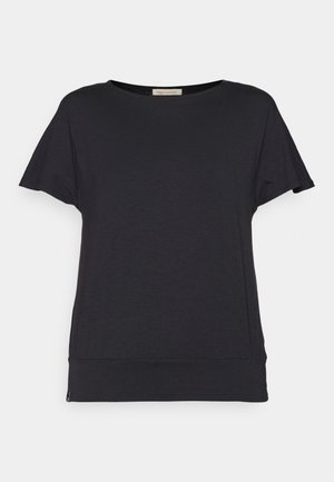 T-shirt nera a maniche corte con scollatura rotonda. Realizzata in un tessuto morbido e leggero. Presenta una vestibilità leggermente ampia e un orlo curvo.
