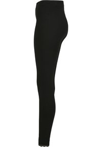 Zwarte leggings van rekbaar stof, met een glad oppervlak en kantdetails bij de enkels. Slim fit ontwerp met een middelhoge taille.