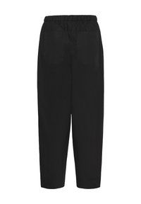 Pantalon noir ample avec taille élastique et deux poches arrière, présenté sur fond blanc.