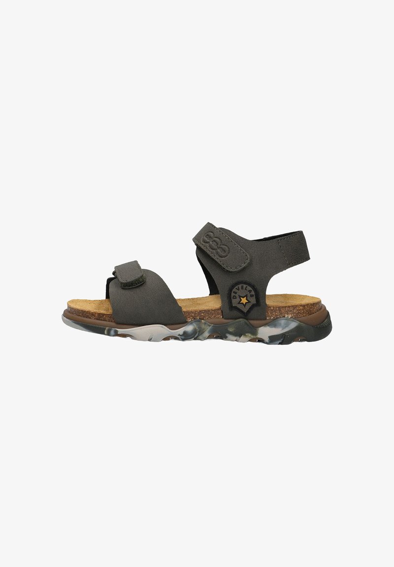 Gray sandals with adjustable straps, cork footbed, and a flexible, patterned rubber outsole featuring a camouflage design.