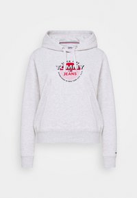 Felpa leggera grigia con tasca frontale, cappuccio con cordini e logo circolare stampato in rosso, nero e blu. Realizzata in tessuto morbido.