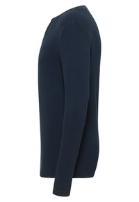 Navy long-sleeve shirt with ribbed texture, crew neck, and minimal branding. Straight hem and fitted design, suitable for layering.