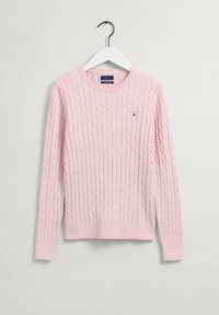 Maglione rosa chiaro a trama cable-knit con maniche lunghe, scollatura rotonda e un piccolo logo sul lato sinistro del petto. Realizzato in morbido tessuto testurizzato.