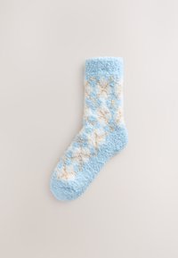 Light blue fuzzy sock featuring a diamond pattern in white and tan, with a soft texture and ribbed cuff.