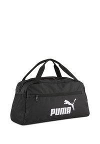 Black duffel bag made of durable fabric, featuring a zip closure, two carry handles, and a white Puma logo on the side. Textured fabric accents.