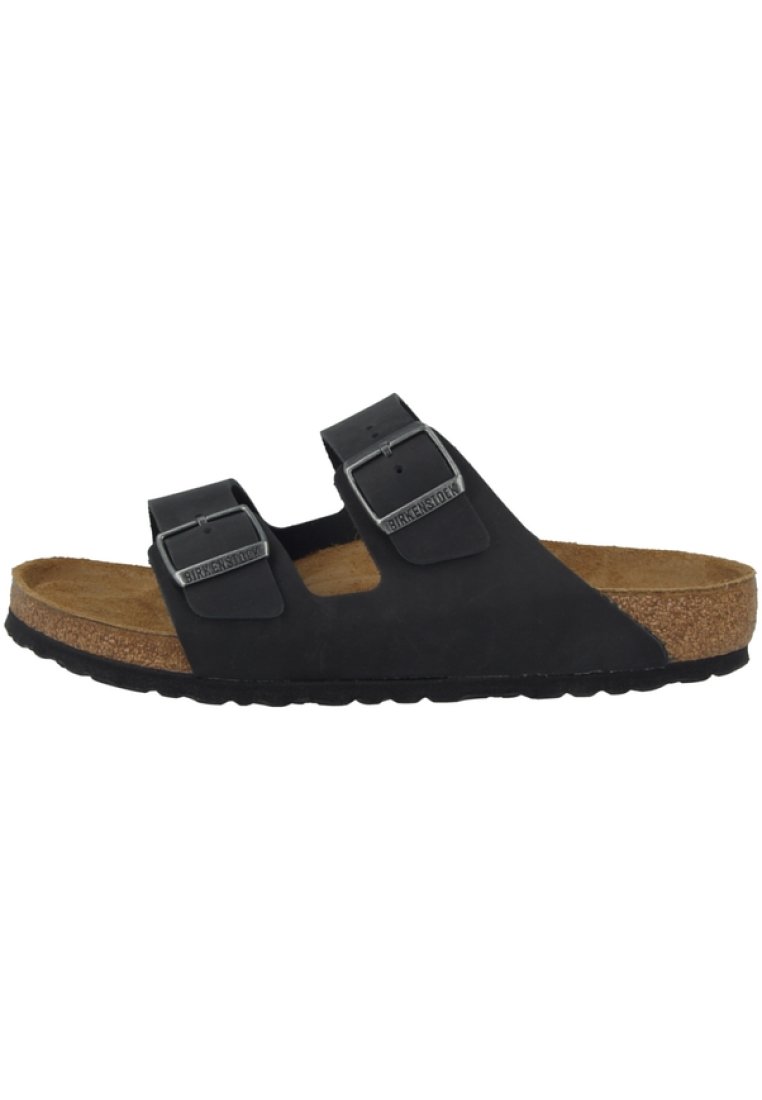 Sandales noires avec deux brides réglables, boucles en métal et une semelle intérieure en liège. Semelle en caoutchouc texturé pour une bonne prise et un confort optimal.