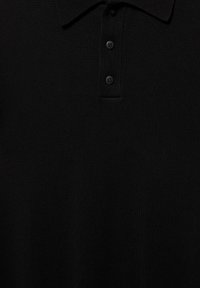 Black knit polo shirt with short collar and three matching black buttons on placket, showing fabric texture.