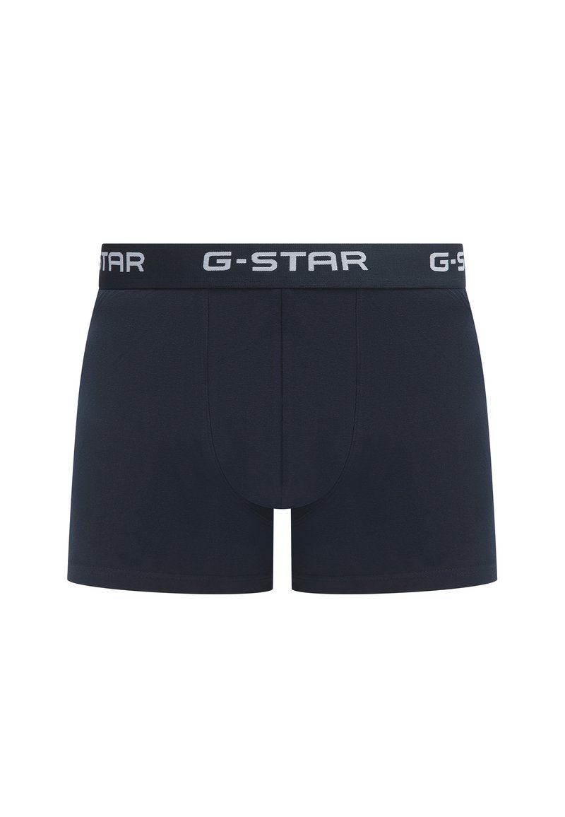 Marineblaue Boxershorts aus weichem Stoff, mit einem elastischen G-Star-Band in kontrastierendem Weiß. Glatte Textur, taillierte Passform.