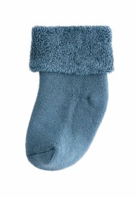 Blauer Socke mit einem plüschigen, strukturierten Bündchen und einem glatten, gerippten Körper. Abgerundete Zehen und subtiler Glanz auf dem Stoff, leichtes Design.