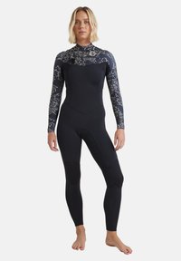 Wetsuit featuring a black body and floral-patterned sleeves, made of stretchy material, with reinforced knee patches and a high neck design.