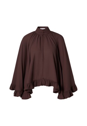 Brun, luftig bluse med høy hals, volangkant og knappdetaljer, laget av et lett stoff. Har lange ermer med rynkedetaljer.