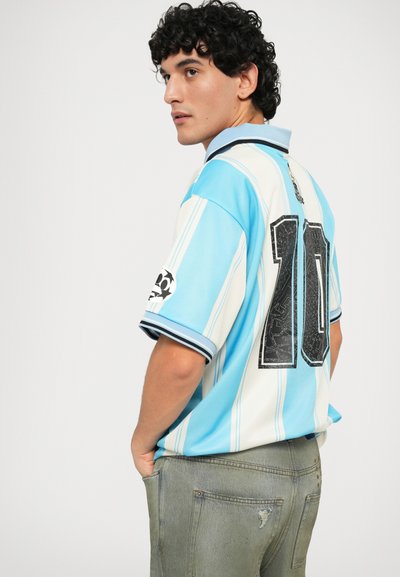 Light blue and white striped jersey with a black number "10" on the back. Features a black collar and shoulder detail with a soccer emblem.