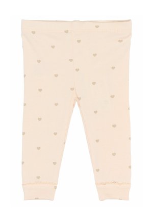 Lys pink baby leggings med små beige hjerter og bølget kant ved ankelmanchetterne.