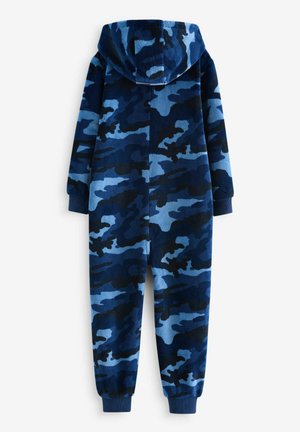 Sininen kamouflagekuvioinen haalari, joka on valmistettu pehmeästä fleece-materiaalista. Haalarissa on huppu, pitkät hihat ja joustavat hihnat nilkoissa ja ranteissa.