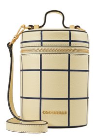 Borsa a tracolla cilindrica in pelle crema con motivo a quadri blu navy, zip dorata, manico superiore e tracolla removibile, brandizzata "COCCINELLE" in oro.