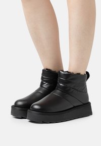 Tamaris Botas para la nieve - black