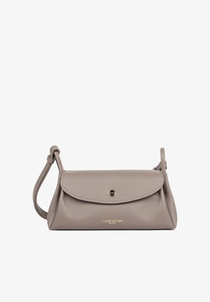 Taupe Lancaster Paris leather shoulder bag with curved flap, gold-tone button closure, and adjustable strap on a white background.
