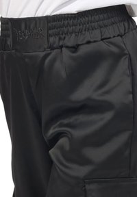 Disclaimer Pantaloni cargo - nero